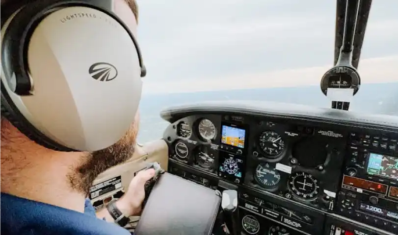 A plane pilot inside the cockpit